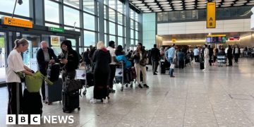 Day of delays after airport check-in system hit