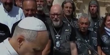 Pope Leo poses with motorbike for charity auction