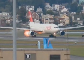 Flight departing from Boston puts on the brakes after spitting out flames