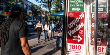 CDC panel votes to limit Covid vaccine eligibility for most healthy adults