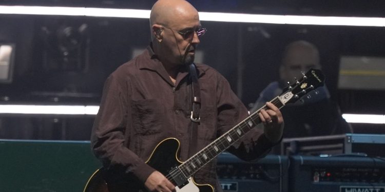 Oasis guitarist ‘Bonehead’ taking break from reunion tour as he reveals prostate cancer diagnosis | Ents & Arts News