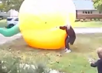 Mom scrambles to control giant inflatable pumpkin