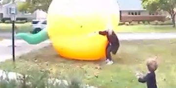 Mom scrambles to control giant inflatable pumpkin