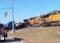 Moment train collides with lorry carrying vehicles in Texas