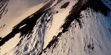 Aerial video captures eruption of snowy Mount Etna