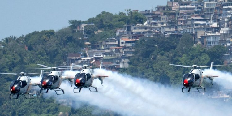 Spanish Air Force helicopter show amazes Rio beachgoers