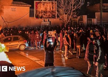 Iran warns it will retaliate if US attacks, as hundreds killed in protests