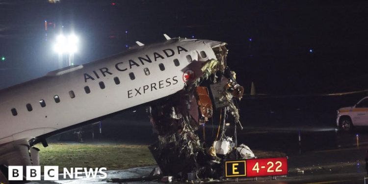 Plane and ground vehicle collide at New York's LaGuardia airport halting flights