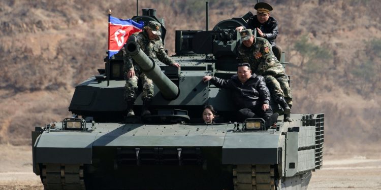 North Korean leader Kim and his daughter ride a tank together during army training