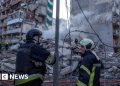 Rescuers search rubble of Kyiv flats after massive Russian strikes kill two
