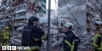 Rescuers search rubble of Kyiv flats after massive Russian strikes kill two