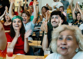 Iran diaspora watches World Cup game with protests, support