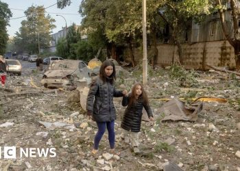 Massive Russian attack on cities across Ukraine kills at least 14 people