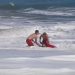 Dramatic video shows a 10-year-old boy rescued from pounding waves