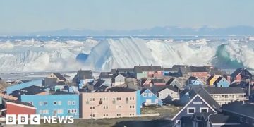 Giant iceberg turns over near Greenland’s coast