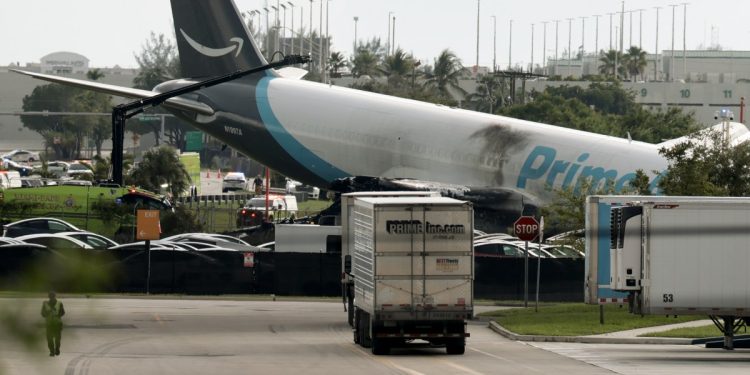 Five dead after Amazon-branded cargo plane overruns runway at Miami airport, striking multiple vehicles