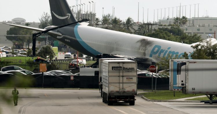 Five dead after Amazon-branded cargo plane overruns runway at Miami airport, striking multiple vehicles
