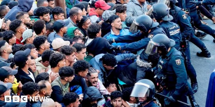 Police begin operation to move migrants from Ceuta beaches