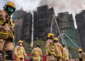 Hong Kong leader apologizes for deadly fire that tested Beijing’s grip on city