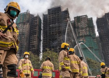 Hong Kong leader apologizes for deadly fire that tested Beijing’s grip on city