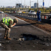 Kyiv bridge hit in further Russian drone attack as German chancellor makes surprise visit